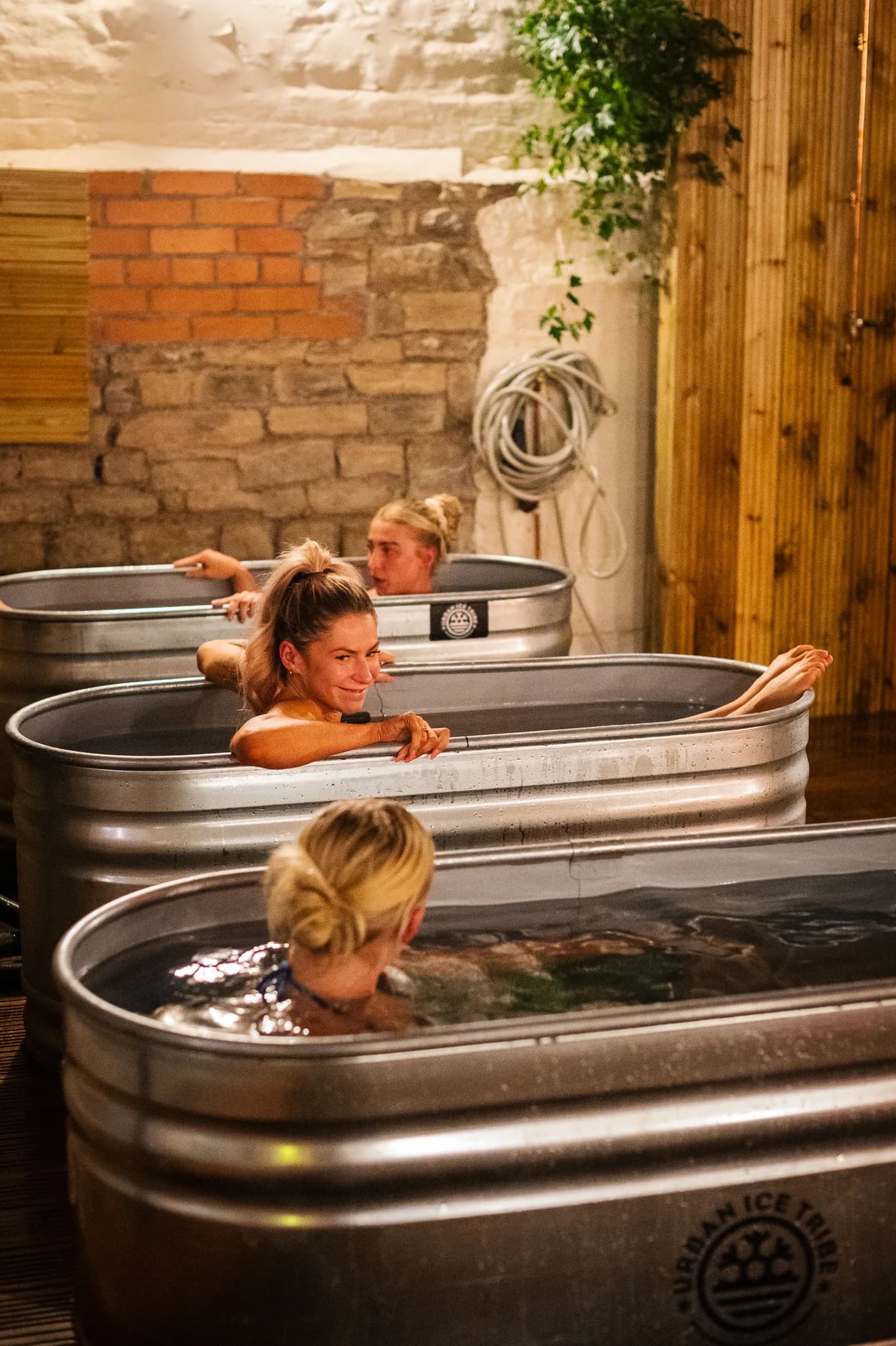 Three guests enjoying the cold plunge pools