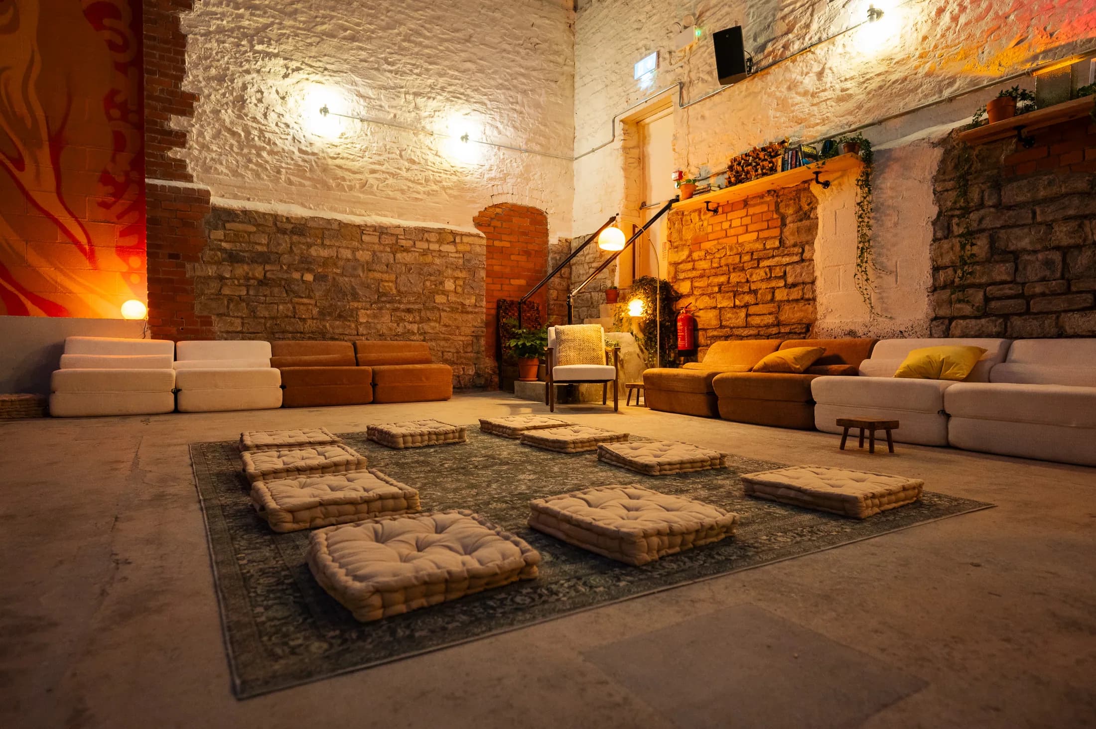 Cushions and low seating in the HOTBOX lounge
